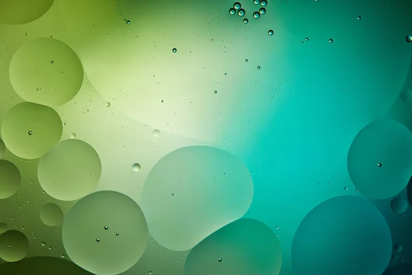 Beautiful green color abstract background from mixed water and oil — Stock Photo