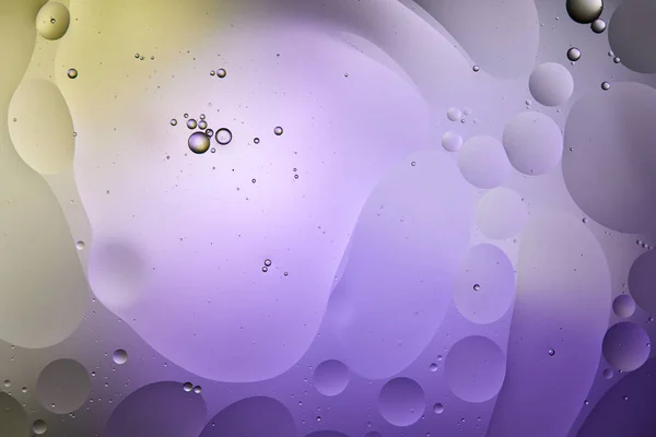 Purple and green color abstract background from mixed water and oil — Stock Photo