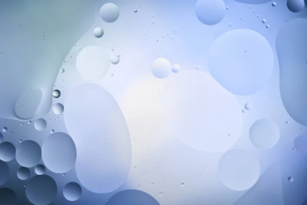 Beautiful color abstract background from mixed water and oil in light blue color — Stock Photo