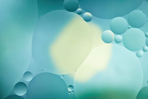 Beautiful abstract background from mixed water and oil in turquoise color — Stock Photo