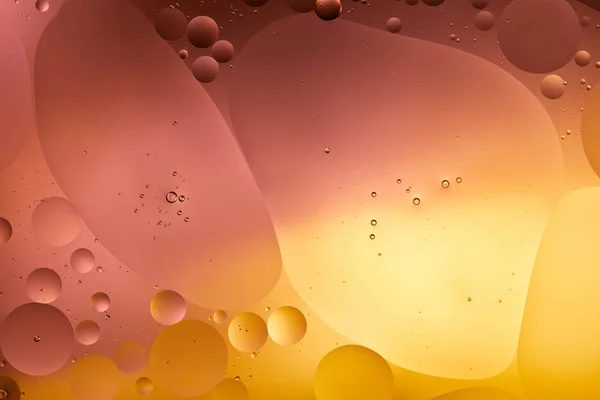 Beautiful orange and pink color abstract background from mixed water and oil — Stock Photo