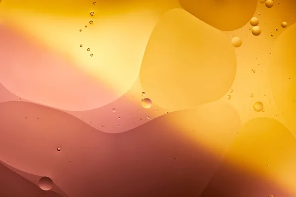 Beautiful abstract background from mixed water and oil in orange and pink color — Stock Photo