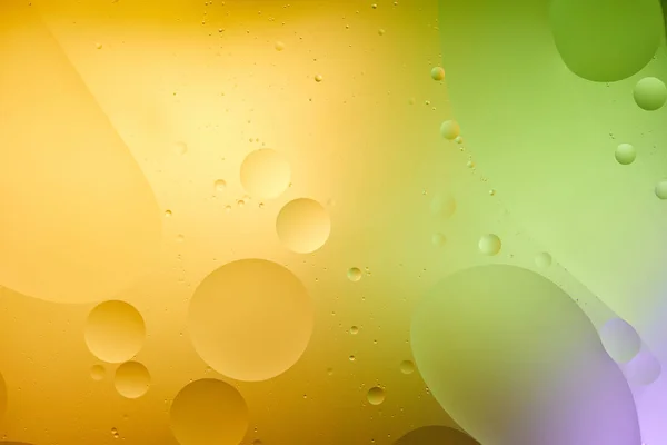 Beautiful orange, purple and green color abstract background from mixed water and oil — Stock Photo