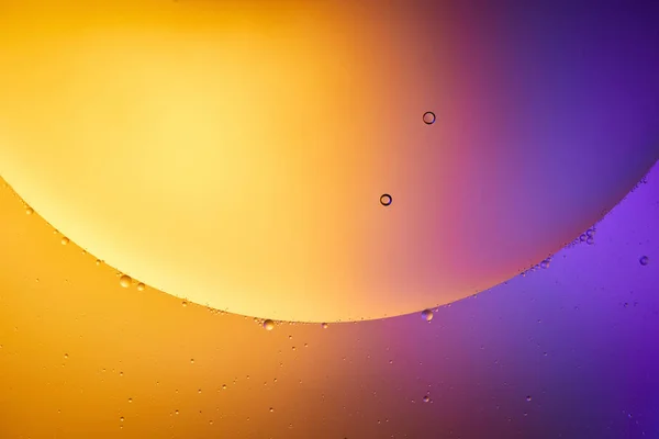 Beautiful abstract orange and purple color background from mixed water and oil — Stock Photo