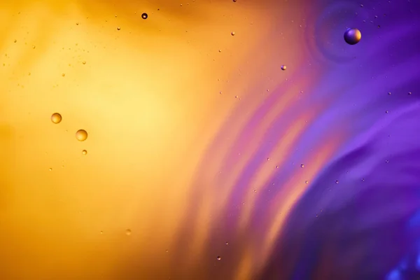 Orange and purple color abstract background from mixed water and oil — Stock Photo