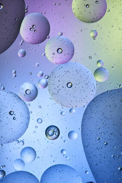 Beautiful abstract background from mixed water and oil in blue, purple and green color — Stock Photo