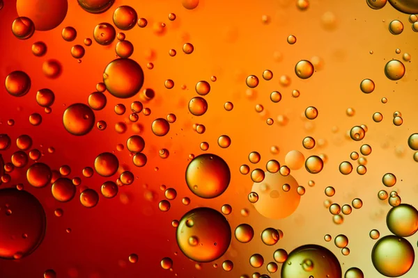 Bellissimo sfondo astratto da acqua mista e olio in colore arancione e rosso — Foto stock