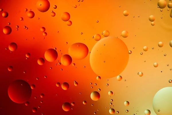 Abstrait orange et rouge fond de couleur de l'eau et de l'huile mélangées — Photo de stock