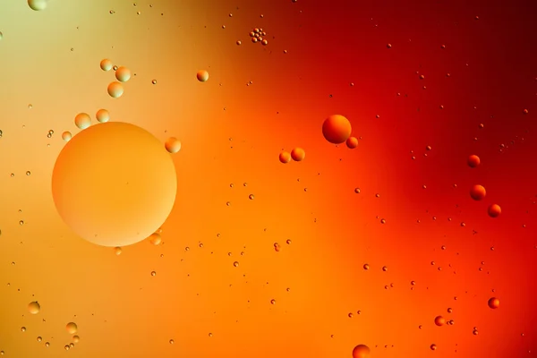 Orange and red color abstract background from mixed water and oil — Stock Photo