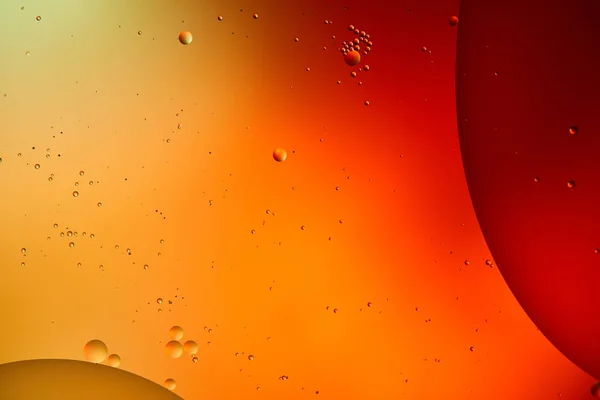 Beautiful abstract background from mixed water and oil in orange and red color — Stock Photo