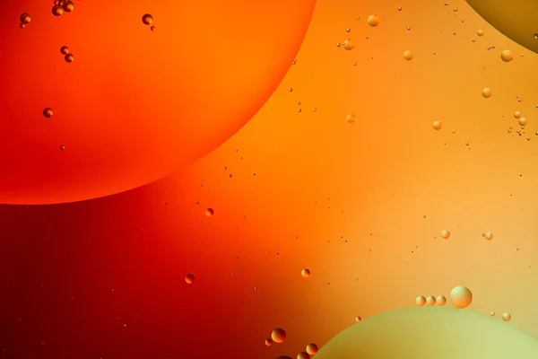 Abstrait orange et rouge fond de couleur de l'eau et de l'huile mélangées — Photo de stock