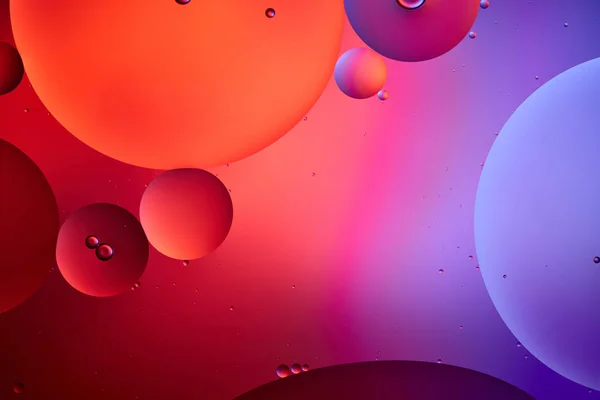 Creative abstract background from mixed water and oil bubbles in pink and purple color — Stock Photo
