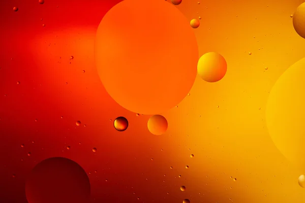 Beautiful abstract background from mixed water and oil in orange color — Stock Photo