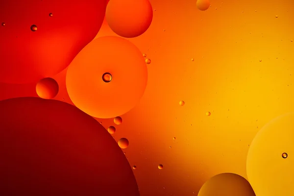 Abstract macro orange and red color background from mixed water and oil — Stock Photo