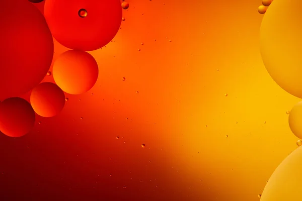 Beautiful abstract background from mixed water and oil in orange color — Stock Photo