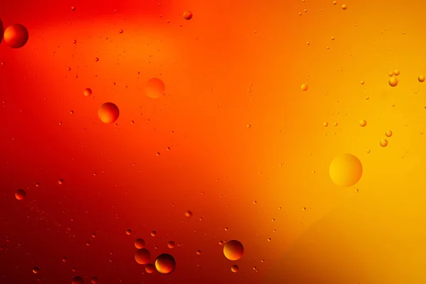 Abstrait orange et rouge fond de couleur de l'eau et de l'huile mélangées — Photo de stock