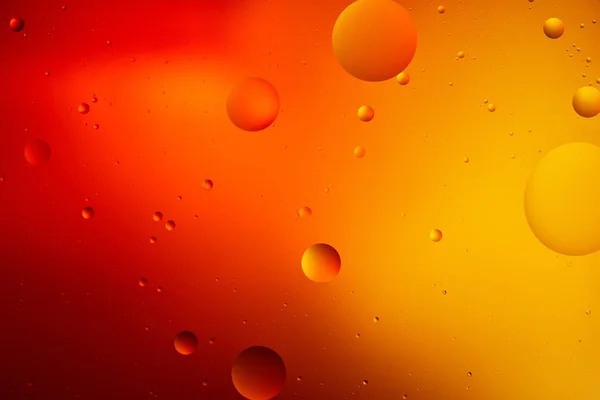 Abstract macro orange and red color background from mixed water and oil — Stock Photo