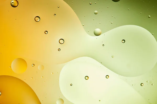 Beautiful green and orange color abstract background from mixed water and oil — Stock Photo