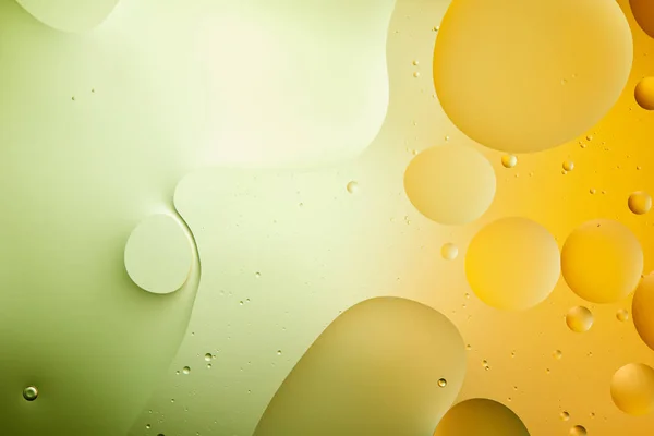 Beautiful green and orange color abstract background from mixed water and oil — Stock Photo