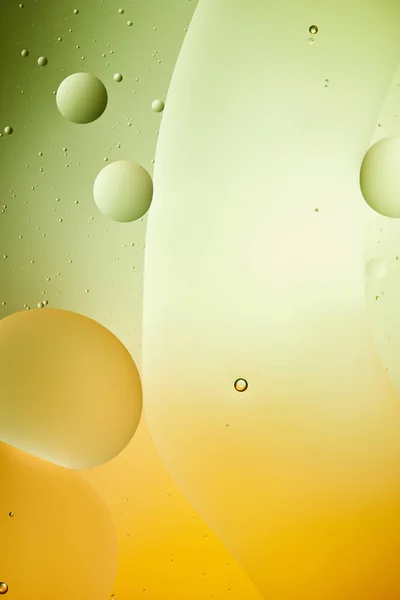 Beautiful green and orange color abstract background from mixed water and oil — Stock Photo