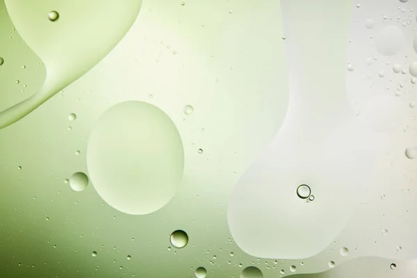 Beautiful light green color abstract background from mixed water and oil — Stock Photo