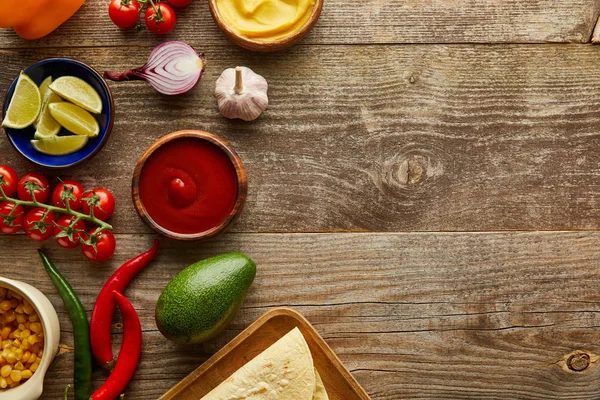 Top view of raw ingredients for taco on wooden background with copy space — Stock Photo