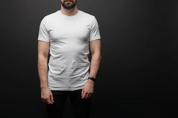 Cropped view of bearded man in blank basic white t-shirt isolated on black — Stock Photo