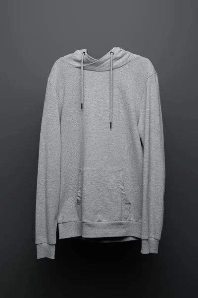 Blank basic grey hoodie on black background — Stock Photo