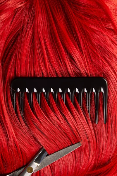 Top view of red hair with scissors and comb — Stock Photo