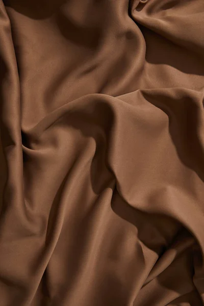 Top view of brown wavy tablecloth — Stock Photo