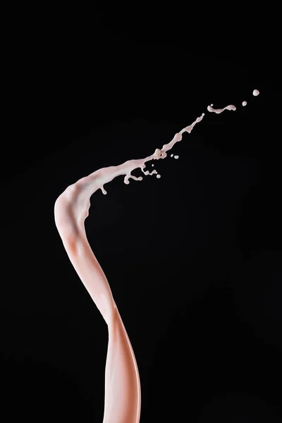 Smooth fresh pink milk splash with drops isolated on black — Stock Photo