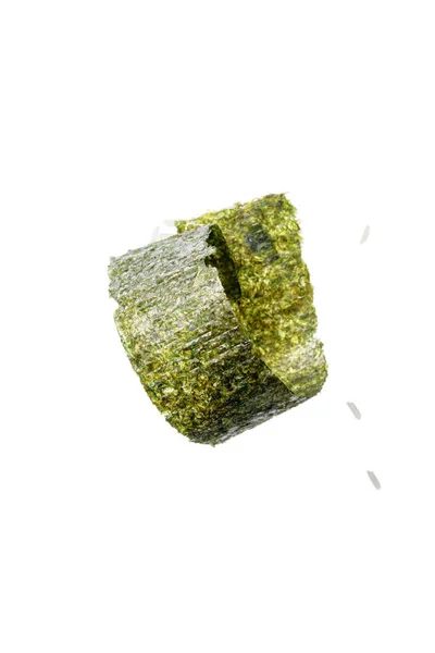 Top view of twisted nori seaweed piece and rice isolated on white — Stock Photo