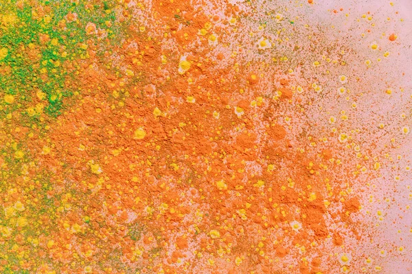 Orange, yellow and green colorful holi paint explosion — Stock Photo