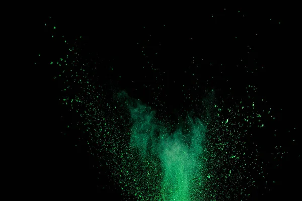 Vert coloré holi peinture explosion sur fond noir — Photo de stock