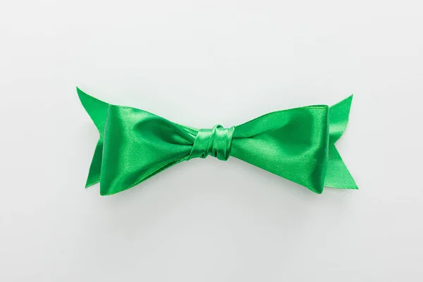 Top view of satin green bow isolated on white — Stock Photo