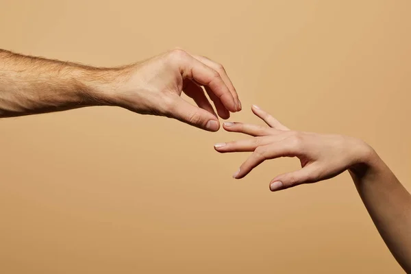 Cropped view of man doing marriage proposal to woman isolated on beige — Stock Photo