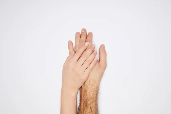 Vue de dessus du couple tenant les mains isolées sur blanc — Photo de stock