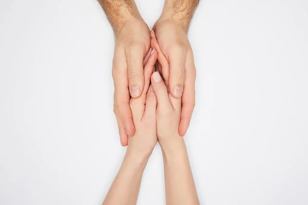Draufsicht des Paares, das die Hände isoliert auf Weiß hält — Stockfoto
