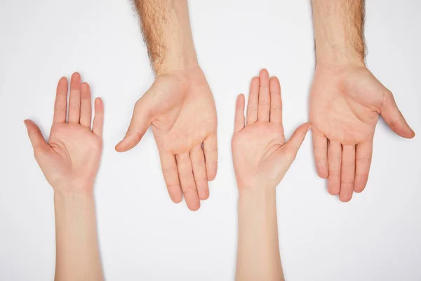 Vista superior de homem e mulher mostrando palmas isoladas em branco — Fotografia de Stock