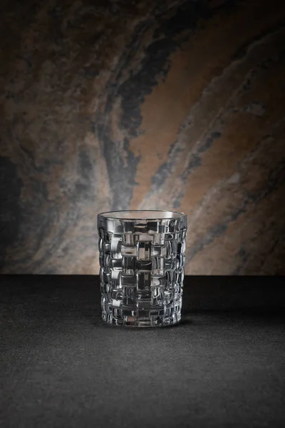 Empty and clean glass on textured background — Stock Photo