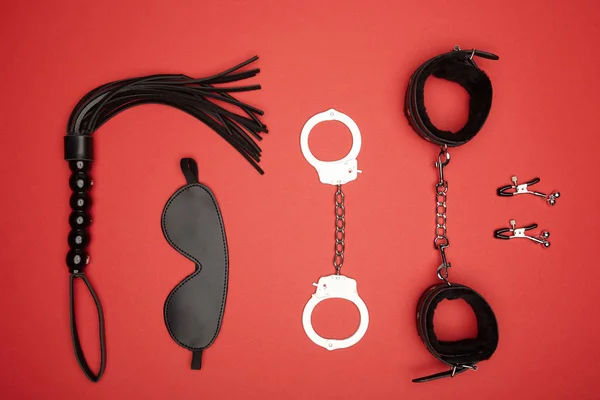 Top view of various sex toys isolated on red — Stock Photo