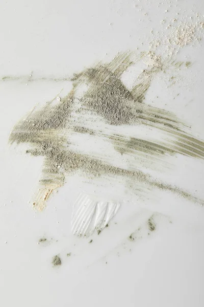 Top view of clay powder, cosmetic and tone cream brushstrokes on grey — Stock Photo