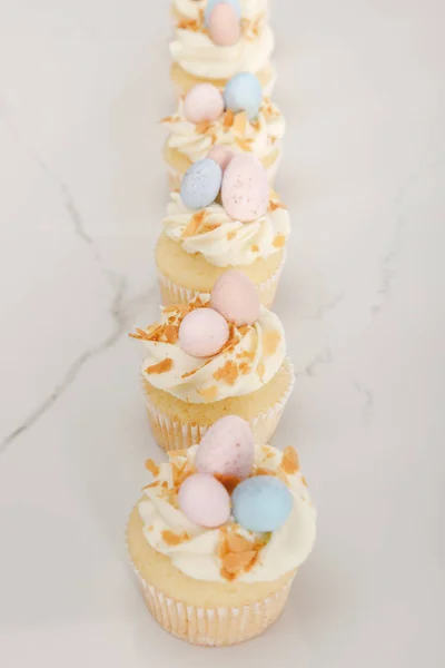 Selective focus of delicious easter cupcakes on white background — Stock Photo