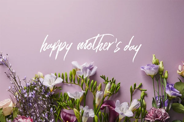 Top view of beautiful flowers on violet background, happy mothers day illustration — Stock Photo