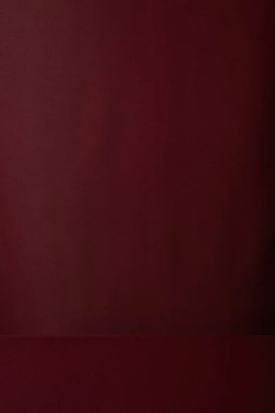 Бургундский мягкий текстурированный фон ткани с копировальным пространством — стоковое фото