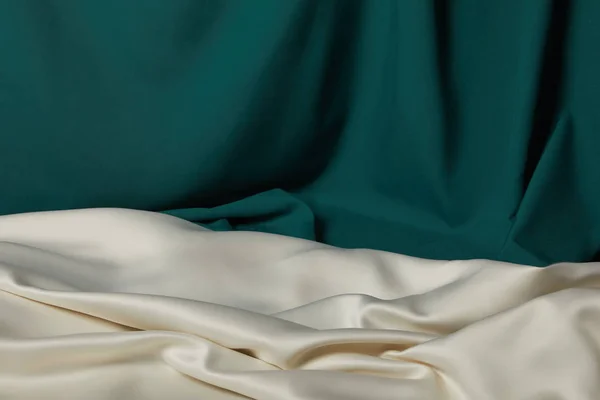 Close up view of emerald and white soft and wavy silk fabric — Stock Photo