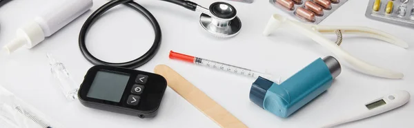High angle view of medical objects on white, panoramic shot — Stock Photo