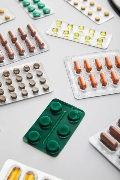 Selective focus of different medicines on white — Stock Photo