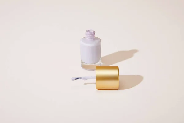 High angle view of opened bottle of nail polish on white — Stock Photo