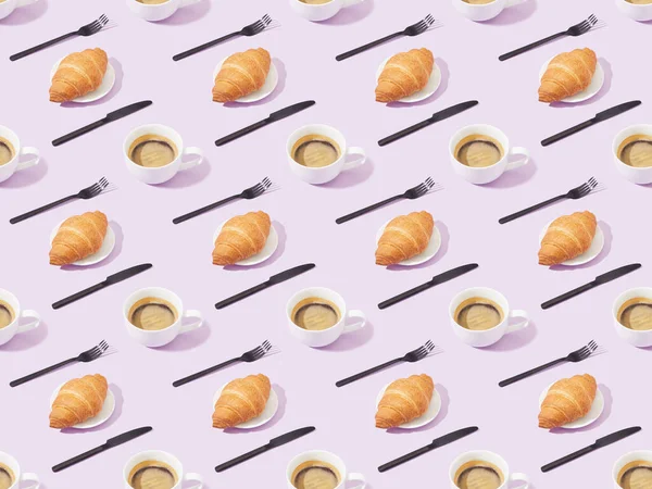 Black forks and knives, croissants and coffee on violet, seamless background pattern — Stock Photo